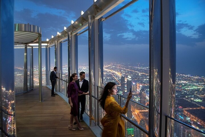 Experience stunning views from the world's highest observation deck where luxurious refreshments and guided insights create lasting memories against the breathtaking Dubai skyline. A unique journey awaits.